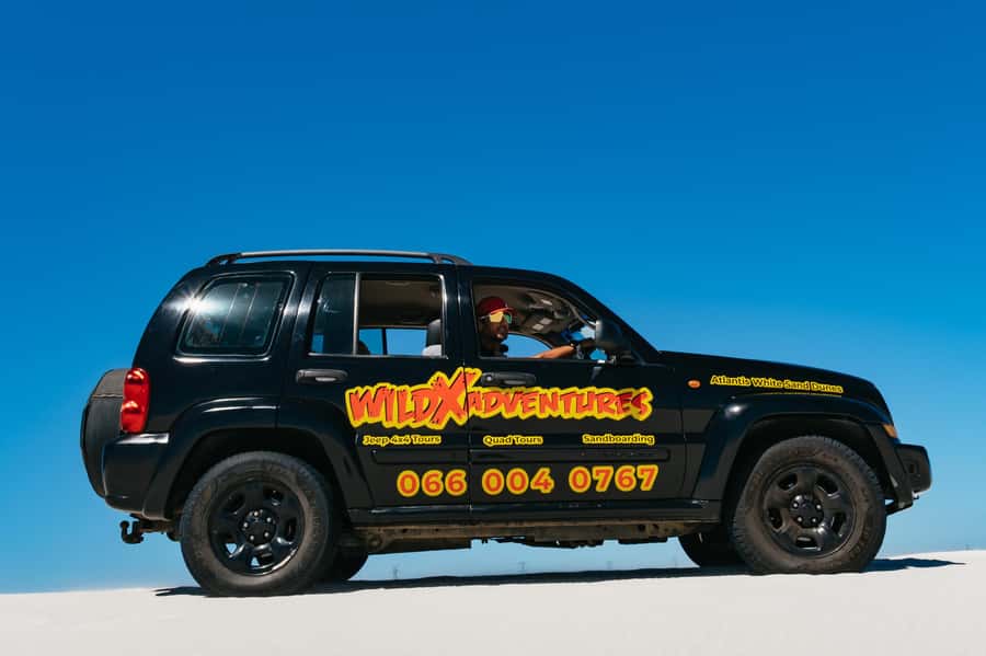 Cape Town: Atlantis White Sand Dunes Sandboarding Adventure - Riding down the white dunes