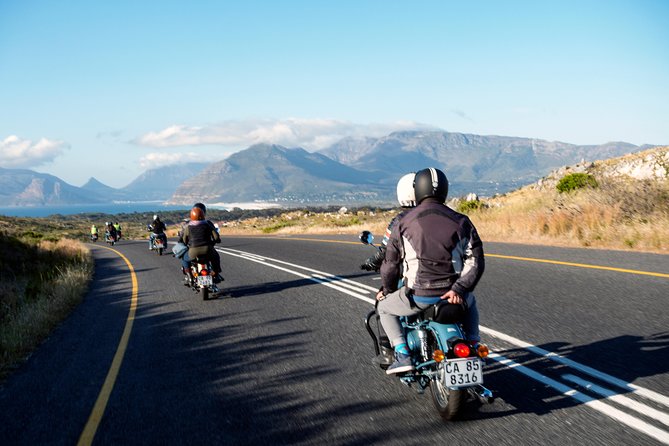 Full Day Cape Peninsula Motorcycle Tour on a Royal Enfield - The return through Constantia and Camps Bay