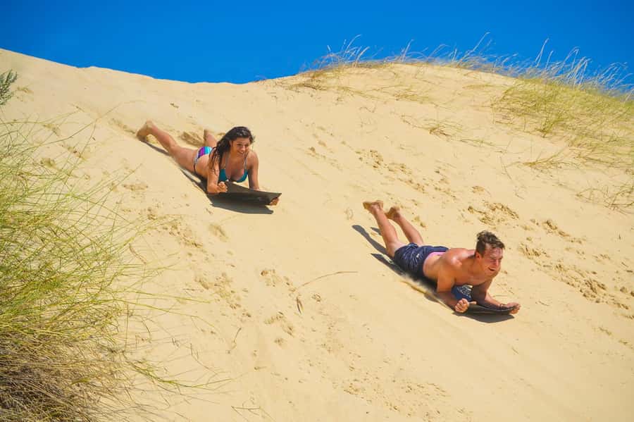 Port Elizabeth: Sandboarding with Short Boat Trip - Learning to stand, slide, and try again