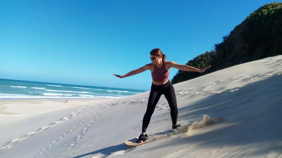 Sandboarding Jeffreys Bay - Sitting boards make this a family-friendly outing